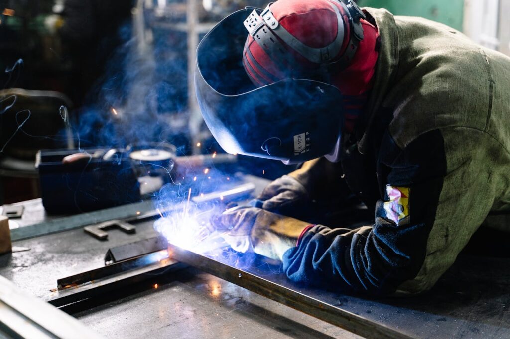 pexels-photo-2381463 Man Welding Metal Bars