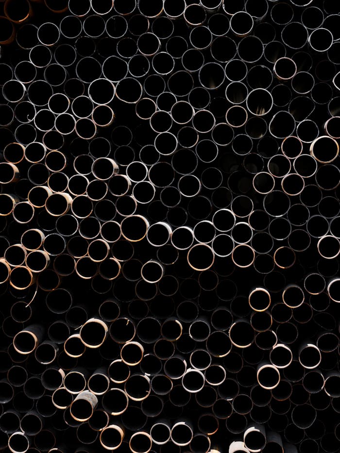 pexels-photo-27312811 old rusty pipes in the junkyard